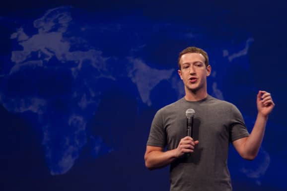 Zuckerberg in front of global display